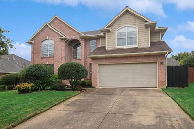 Front of property featuring a garage and a front lawn | Image 1