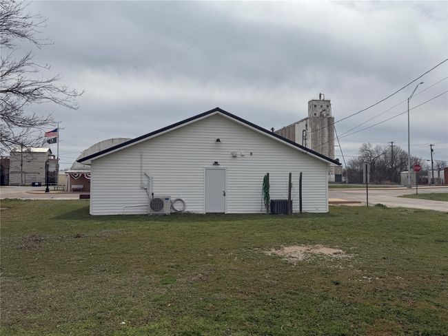 Back of house with a lawn and ac unit | Image 19