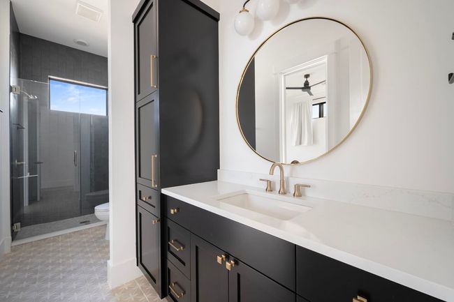 Bathroom with vanity, a shower stall, and toilet | Image 29