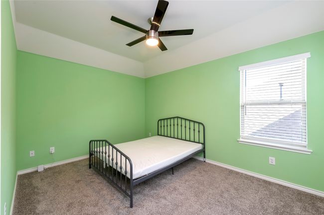 Carpeted bedroom featuring baseboards and a ceiling fan | Image 26