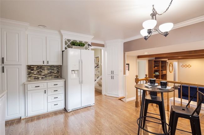 updated kitchen with TWO pantries overlooks the family room | Image 9