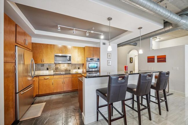 Enjoy ample cabinet and storage space, perfect for keeping the kitchen organized and clutter-free. | Image 7