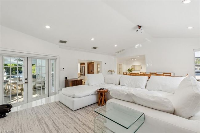 Living room with visible vents, french doors, recessed lighting, and lofted ceiling | Image 13