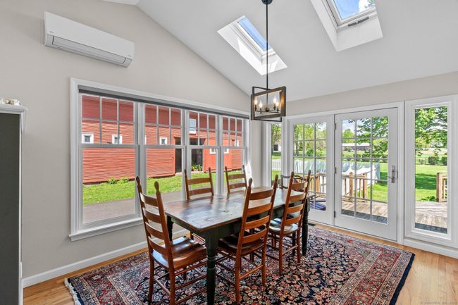 Picturesque eating space with the convenience of a deck right through the doors! | Image 8