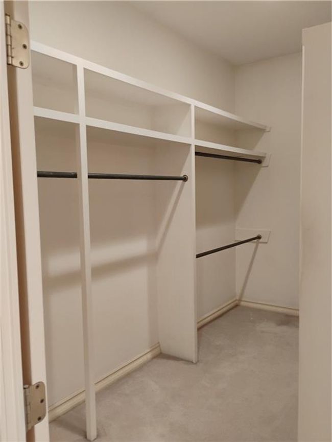 Primary Bedroom Walk in closet #2 featuring light colored carpet | Image 54