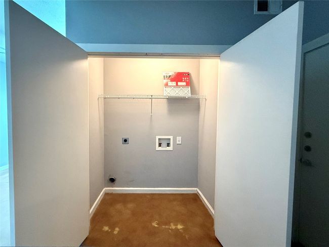 Laundry room featuring electric dryer hookup, hookup for a washing machine, and baseboards | Image 8