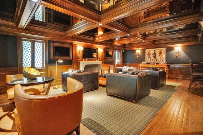 Custom cabinetry w. coffered ceiling and 3 TVs | Image 17