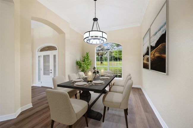 Formal dining off the foyer, with window looking out to front yard. Virtually staged. | Image 7