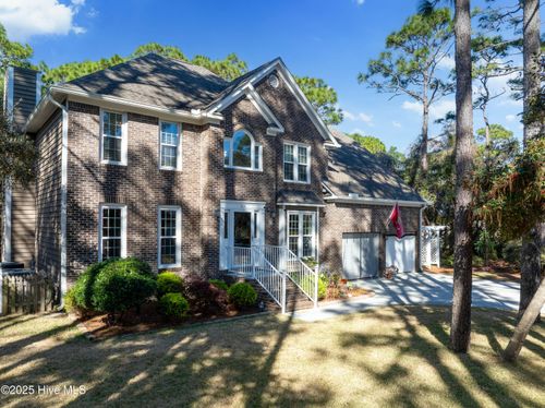 504 Perwinkle Way, Caswell Beach, NC, 28465-8454 | Card Image