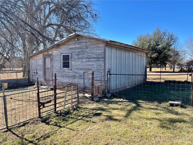 View of outdoor structure with a lawn | Image 20