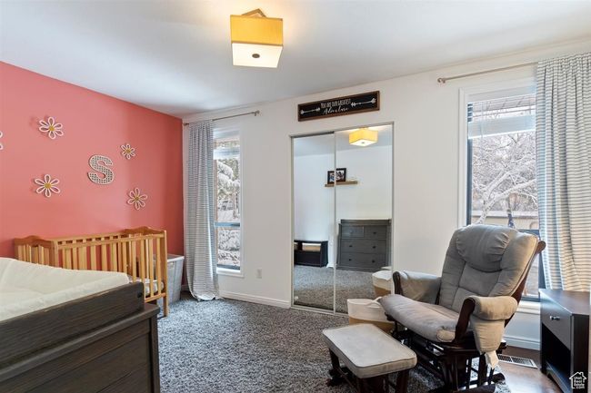 Bedroom with a closet, carpet floors, and baseboards | Image 29