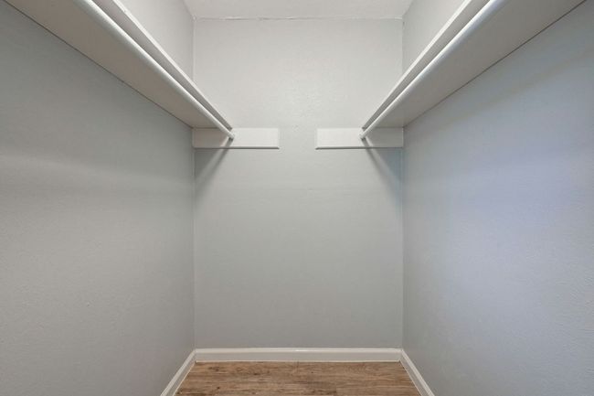 Walk in closet with wood finished floors | Image 20
