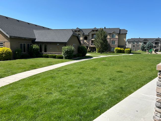 View of front facade with a residential view and a front yard | Image 8