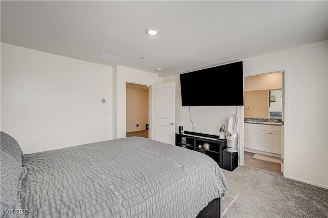 Bedroom featuring light colored carpet | Image 16