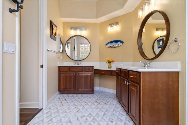 Primary bath twin vanities & Mosaic marble floor | Image 16