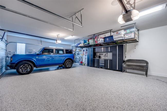 Garage featuring custom built in cabinet storage system | Image 22