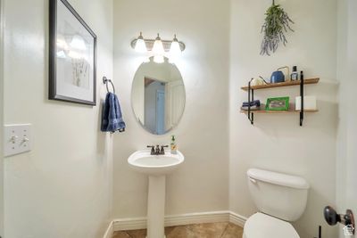 Bathroom featuring tile floors and toilet | Image 3