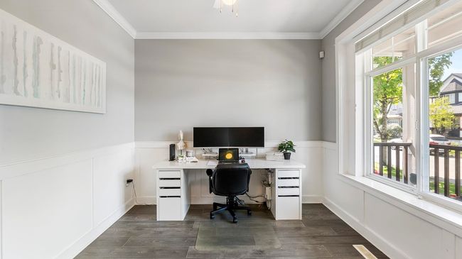 Office area featuring crown molding, dark wood-style floors, and wainscoting | Image 7