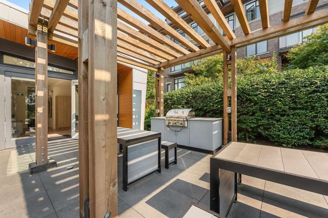 View of patio / terrace with exterior kitchen, a pergola, and grilling area | Image 33