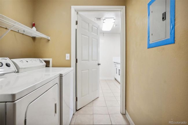 View from the laundry room looking out towards the kitchen. | Image 23