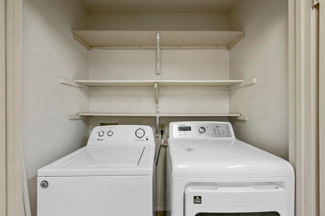 Laundry room with washing machine and clothes dryer | Image 13