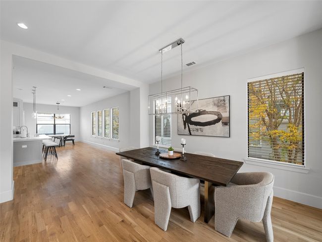 Dining room with a chandelier, light wood-style flooring, and recessed lighting | Image 10