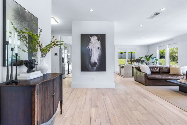 Entry way directs you to the open concept family room, dining room and kitchen | Image 7