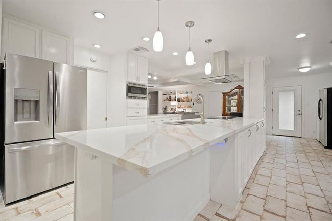 Fit for the most skilled home chef! Make note of the upgraded recessed and pendant lighting as well. | Image 11