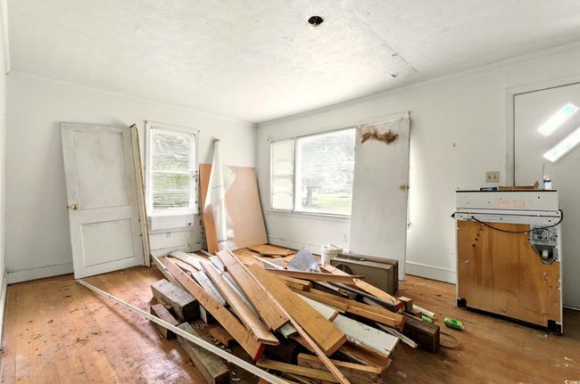 Misc room with hardwood / wood-style floors | Image 7