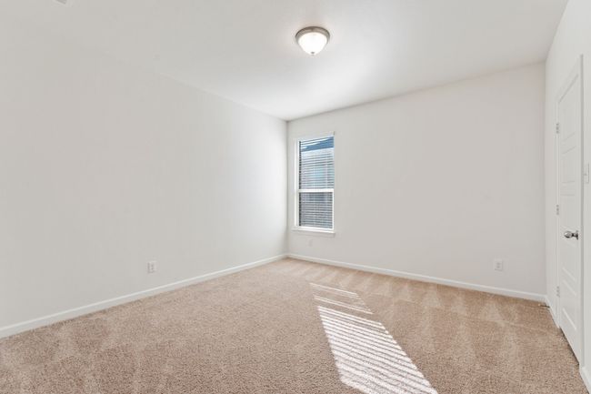 Empty room featuring light colored carpet and baseboards | Image 18