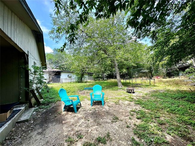 View of yard with an outdoor fire pit | Image 5