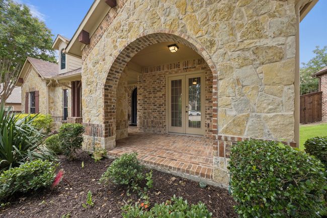 Entrance to property featuring stone siding | Image 4