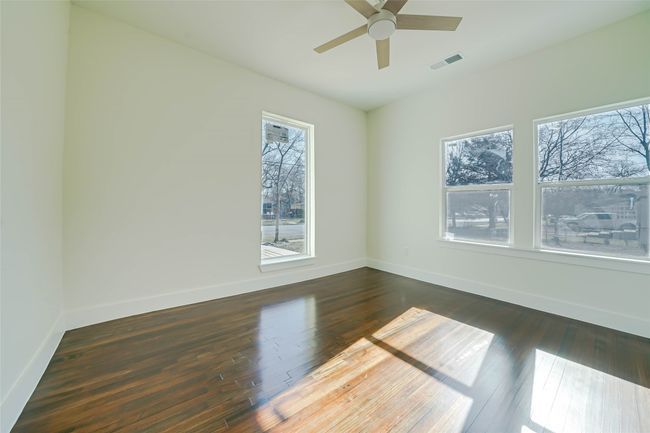 Empty room with dark hardwood / wood-style floors and ceiling fan | Image 24