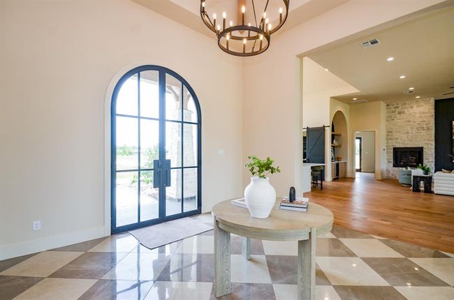 Front door, foyer. Kitchen in background. | Image 21