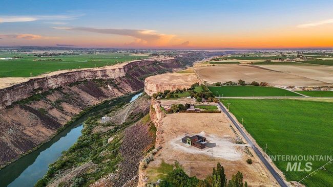 Aerial overview of property's location featuring a large body of water and rural landscape | Image 48