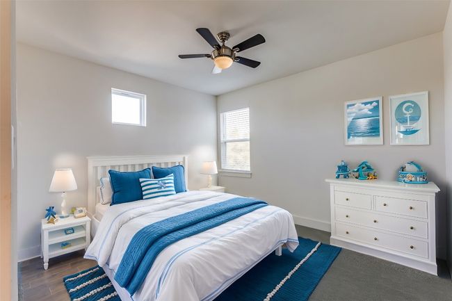 Bedroom with a ceiling fan, baseboards, and wood finished floors | Image 26