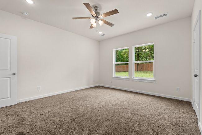 Bedroom featuring carpet floors, ceiling fan, recessed lighting, baseboards, and a smoke detector | Image 21