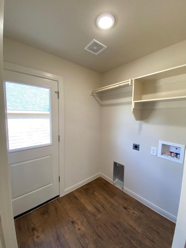 Laundry area with washer hookup, electric dryer hookup, dark wood-type flooring, and baseboards | Image 14
