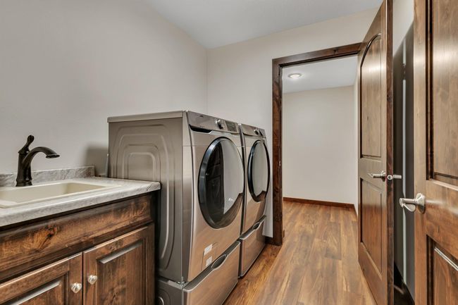 Laundry with washer, dryer and sink | Image 23