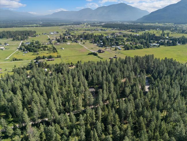 Aerial view of property's location featuring a mountain backdrop | Image 32