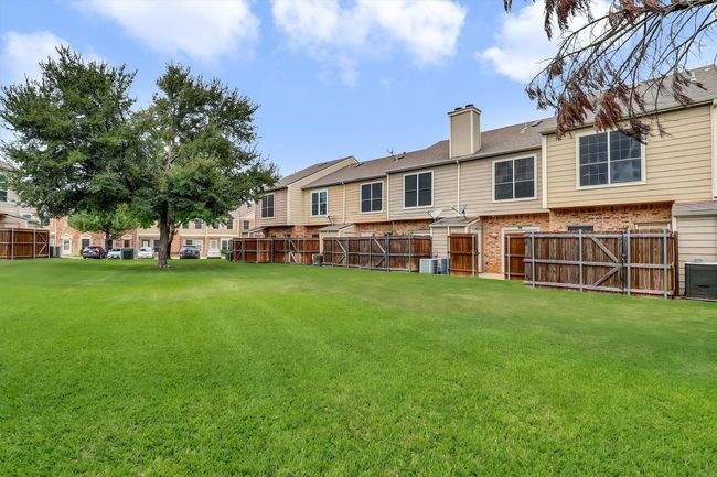 Fenced backyard featuring a residential view | Image 17