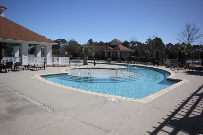 View of pool with a patio area | Image 6