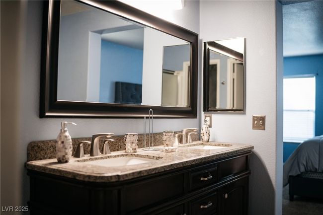 Full bathroom featuring double vanity and ensuite bath | Image 11