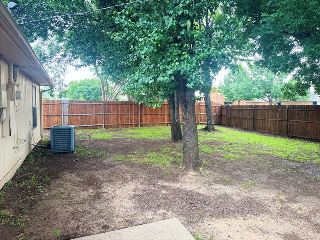 View of yard with a fenced backyard and central AC | Image 10