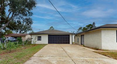 1905 County Rd 235, Alvin, TX Two car garage with storage space to the side, new roof and long 2 lane parking space. | Image 3