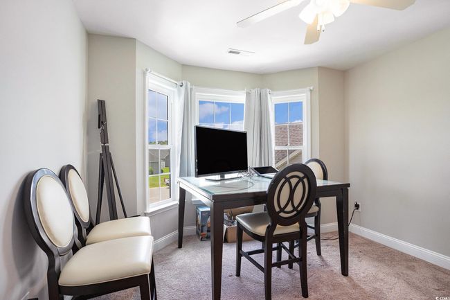 Office area with carpet and a ceiling fan | Image 22