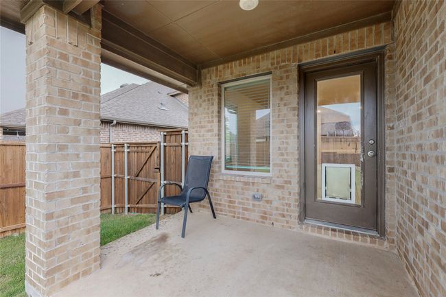 View of patio / terrace featuring a gate and fence | Image 38