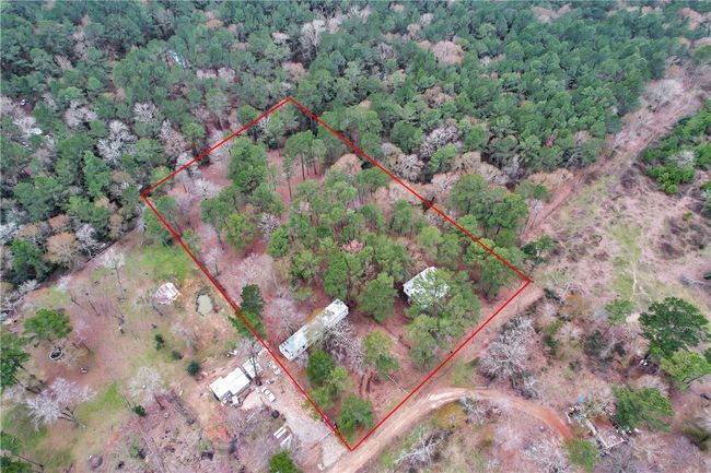 Aerial overview of property's location with property parcel outlined | Image 32