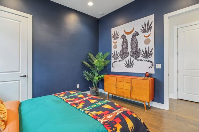 Bedroom with wood finished floors and recessed lighting | Image 30