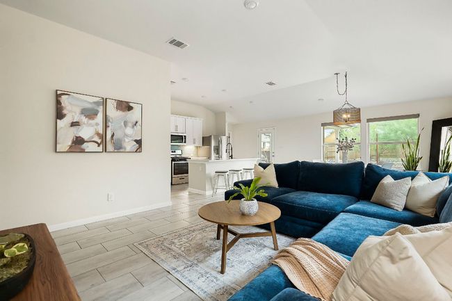 The gray, wood-grained tiles give it a modern feel throughout the open-concept layout. | Image 4